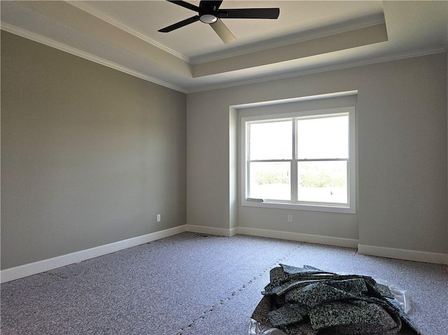 14608 Aspen Cir, Basehor, KS 66007 - spare room with a tray ceiling, crown molding, a ceiling fan, carpet, and baseboards