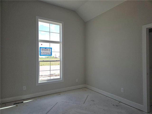 14608 Aspen Cir, Basehor, KS 66007 - empty room featuring plenty of natural light, baseboards, and vaulted ceiling