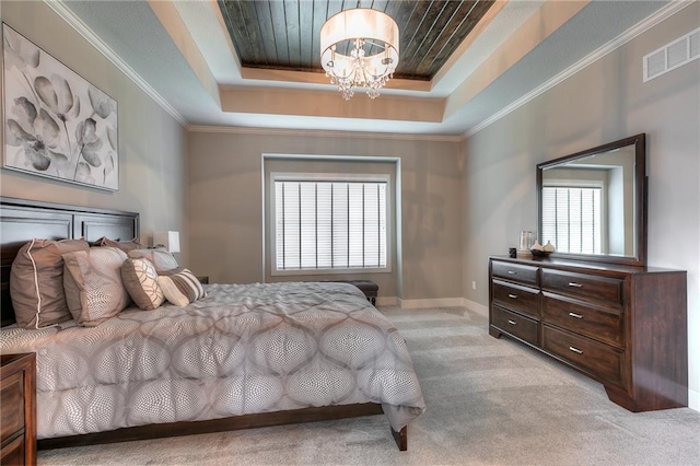 14608 Aspen Cir, Basehor, KS 66007 - bedroom featuring a chandelier, a tray ceiling, light colored carpet, crown molding, and baseboards