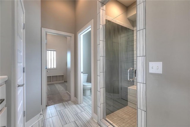 14608 Aspen Cir, Basehor, KS 66007 - bathroom featuring a stall shower, toilet, and vanity