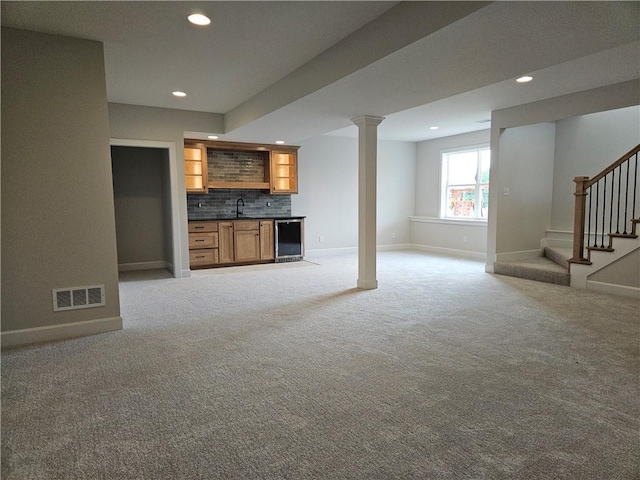 14608 Aspen Cir, Basehor, KS 66007 - unfurnished living room with wet bar, recessed lighting, light carpet, and stairway