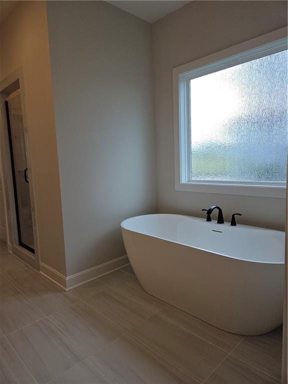14608 Aspen Cir, Basehor, KS 66007 - bathroom with a soaking tub and a shower stall