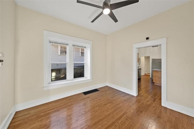 unfurnished room featuring ceiling fan and wood-type flooring