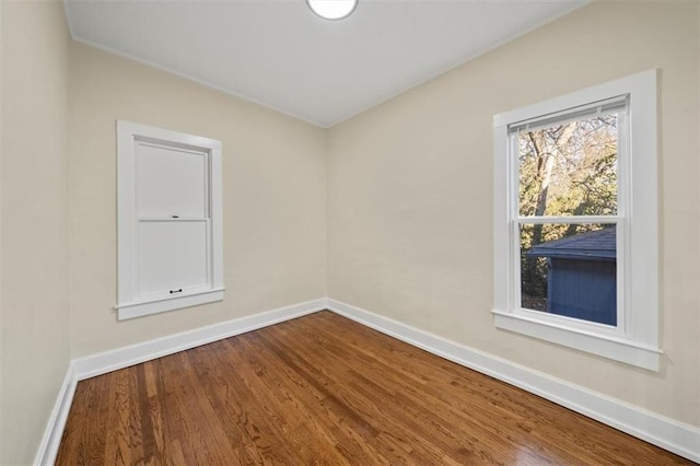 empty room with hardwood / wood-style floors