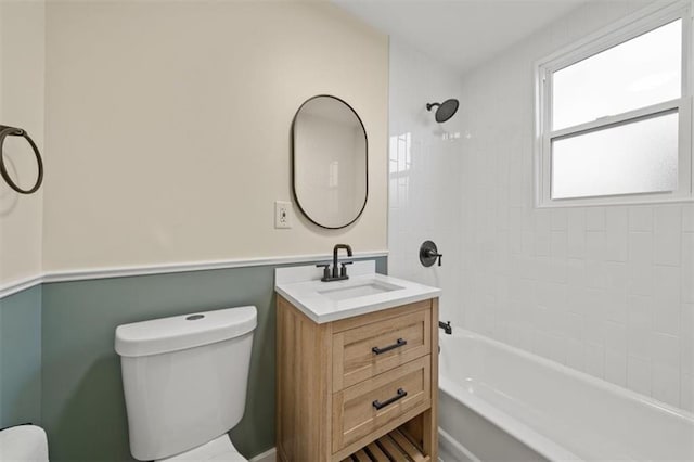 full bathroom featuring vanity, toilet, and tiled shower / bath