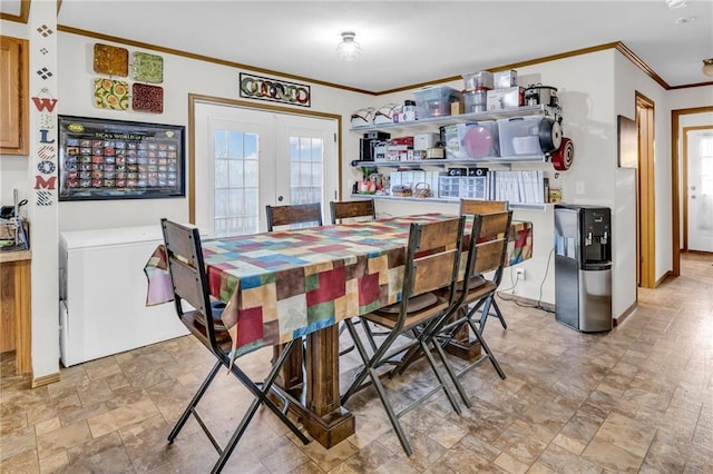 dining area with ornamental molding and french doors