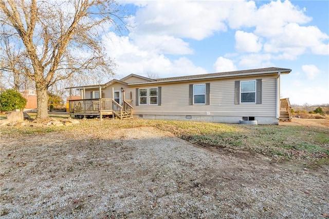 manufactured / mobile home featuring a wooden deck