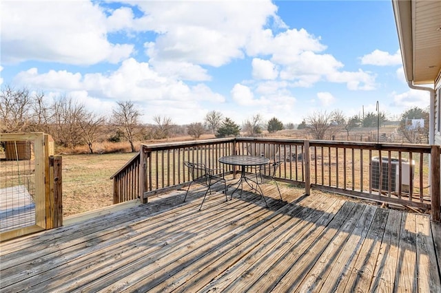 wooden terrace featuring central AC unit