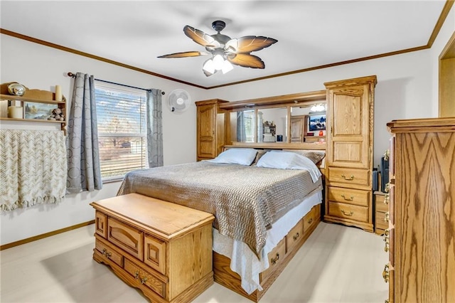 bedroom with ceiling fan and ornamental molding