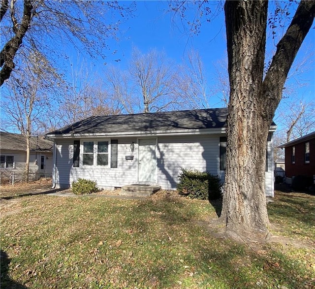 view of front of home with a front yard