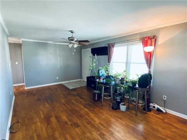 miscellaneous room with dark hardwood / wood-style floors, ceiling fan, and crown molding