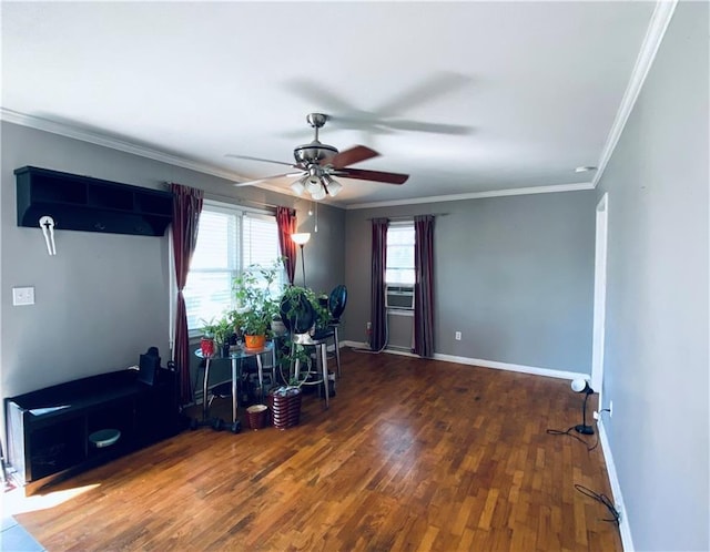 interior space featuring a wealth of natural light, crown molding, ceiling fan, and dark hardwood / wood-style floors