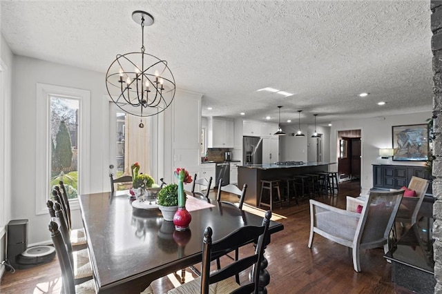 dining room with a chandelier, plenty of natural light, recessed lighting, and dark wood-type flooring