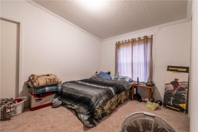 bedroom featuring carpet, a textured ceiling, and ornamental molding