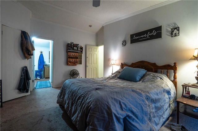 bedroom featuring carpet flooring, ensuite bath, ornamental molding, a textured ceiling, and lofted ceiling