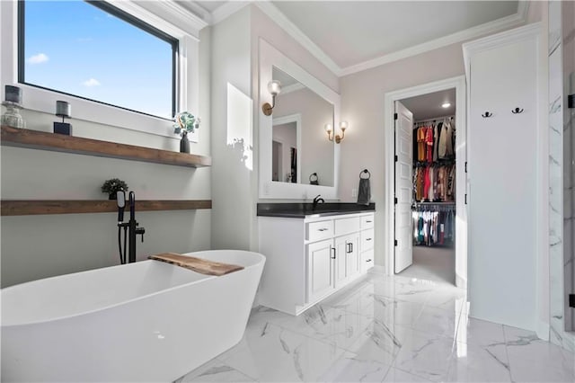 bathroom featuring a bathing tub, vanity, and ornamental molding