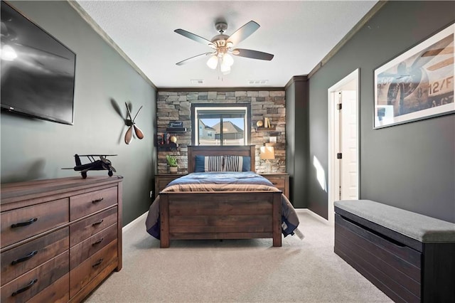 carpeted bedroom with ceiling fan and crown molding