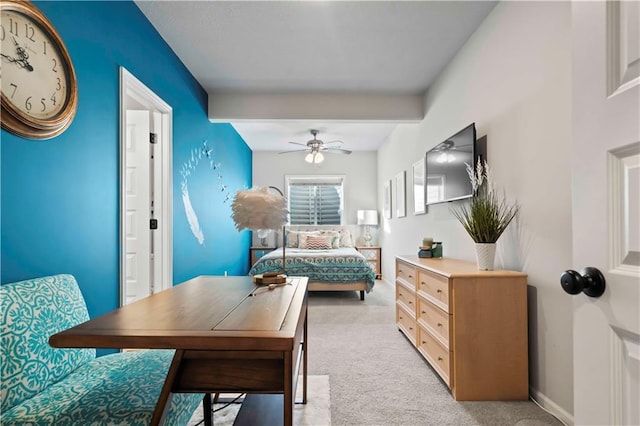 carpeted bedroom featuring beam ceiling, ensuite bath, and ceiling fan