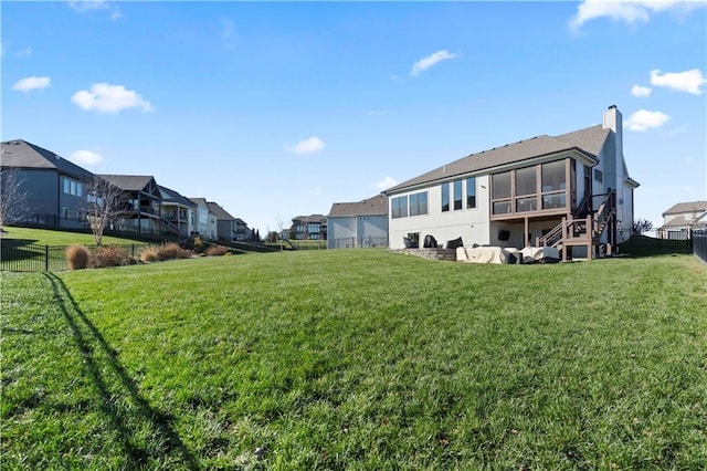 back of house featuring a yard