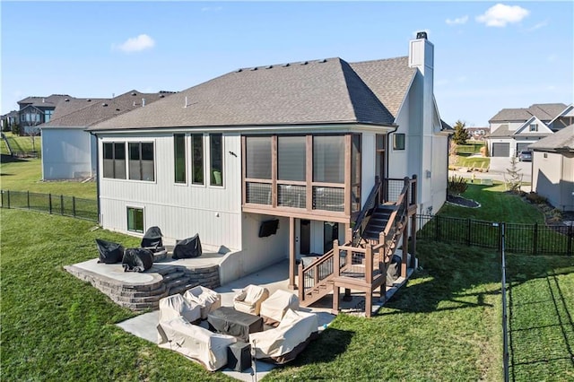 rear view of house featuring an outdoor living space, a yard, and a patio