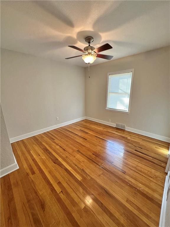 unfurnished room featuring light hardwood / wood-style flooring and ceiling fan