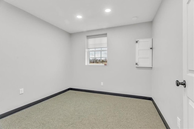 spare room with baseboards, carpet flooring, and recessed lighting