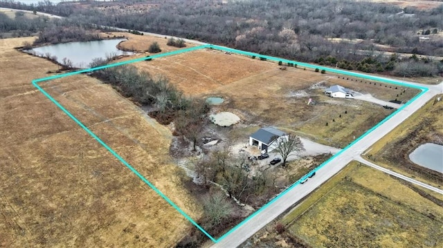 birds eye view of property with a water view and a rural view