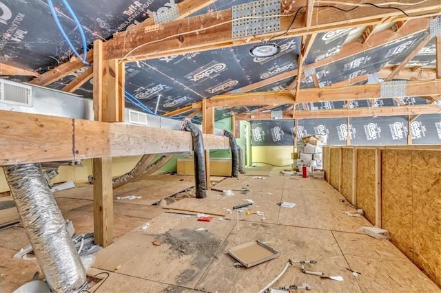 unfinished attic featuring visible vents