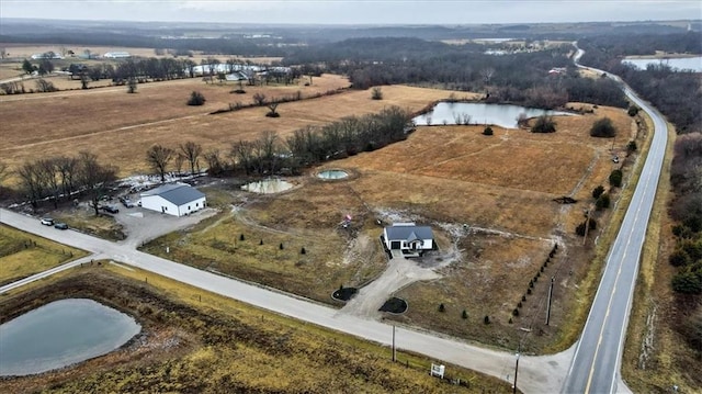 aerial view featuring a rural view and a water view