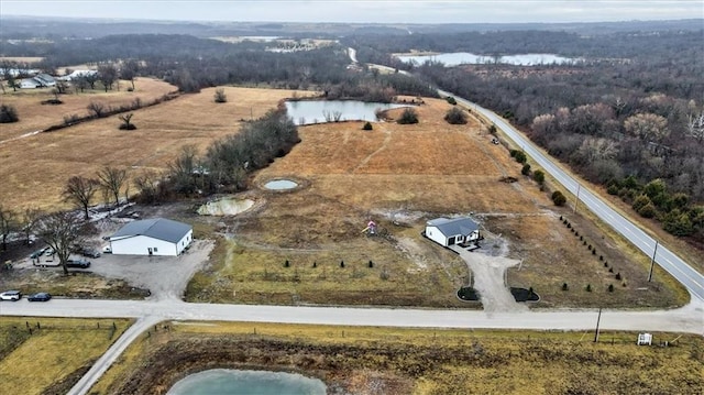 aerial view with a water view and a rural view