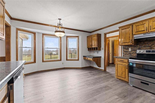 kitchen featuring a healthy amount of sunlight, tasteful backsplash, light hardwood / wood-style flooring, pendant lighting, and appliances with stainless steel finishes