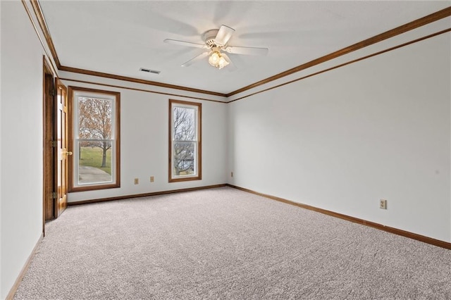 unfurnished room with ceiling fan, ornamental molding, and light carpet