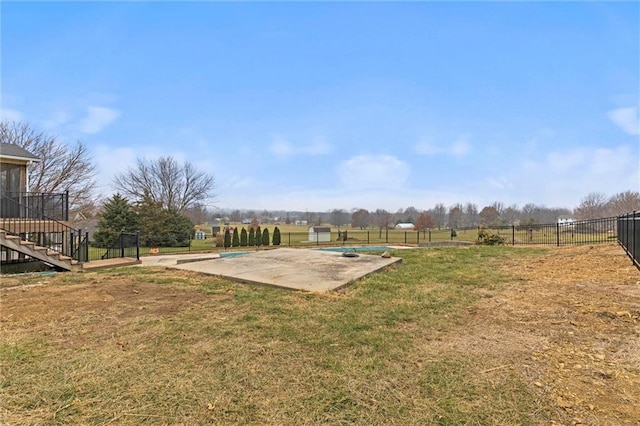 view of yard featuring a patio and a covered pool