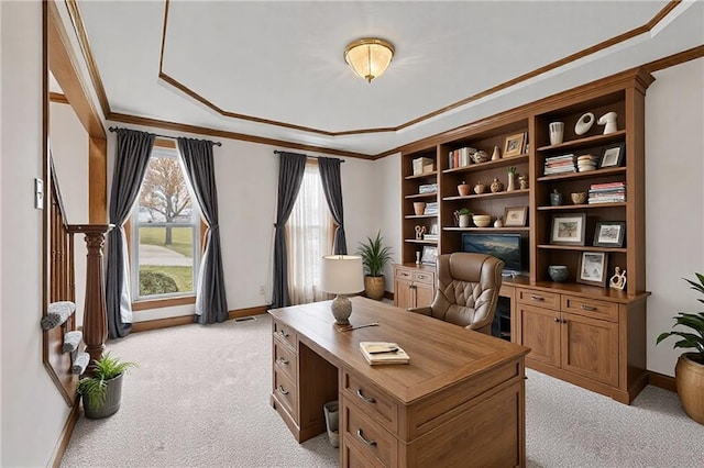 office space featuring baseboards, ornamental molding, and light colored carpet