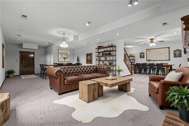 living area featuring stairs, carpet floors, visible vents, and recessed lighting