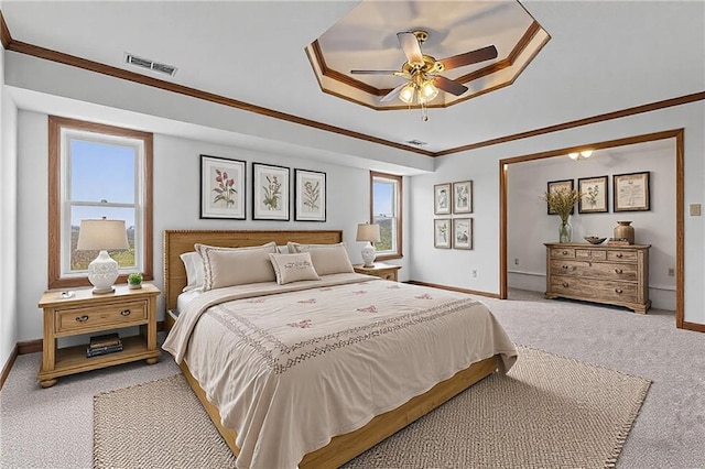 bedroom featuring light colored carpet, visible vents, crown molding, and baseboards