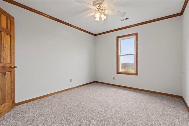 unfurnished room with light carpet, baseboards, visible vents, and ornamental molding