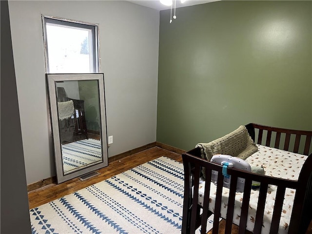 bedroom featuring wood-type flooring