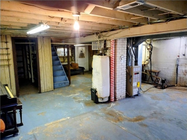 basement with heating unit and gas water heater