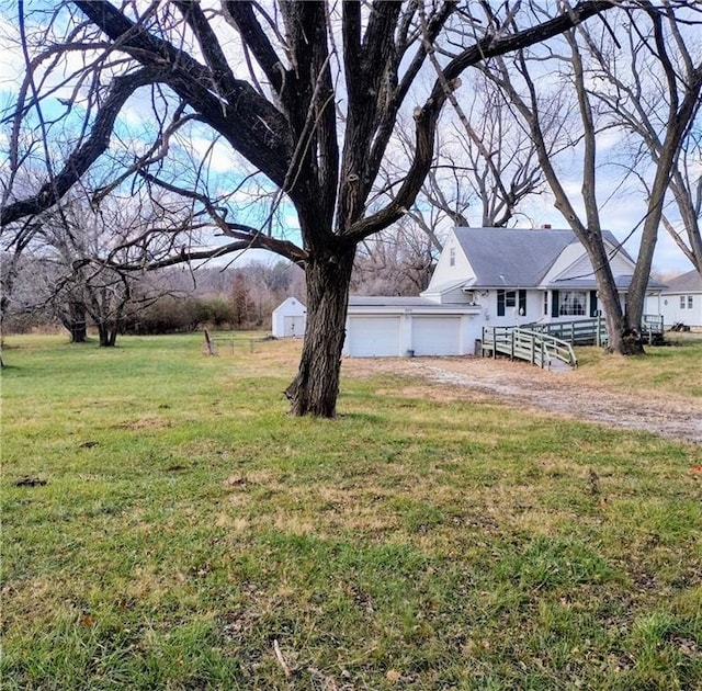 view of yard with a garage