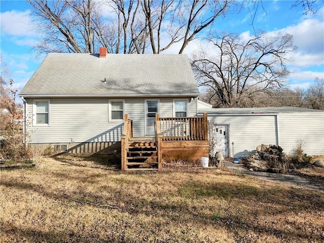 back of property featuring a deck and a yard