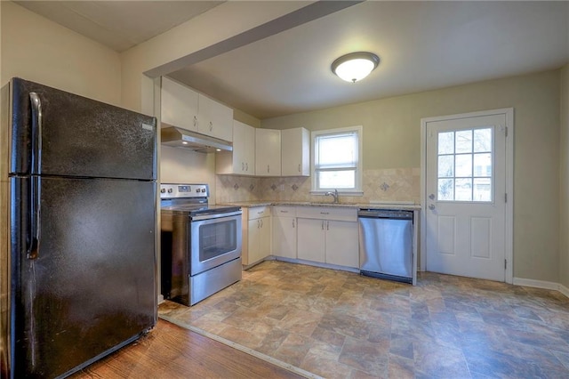 kitchen featuring white cabinets, stainless steel appliances, tasteful backsplash, and sink