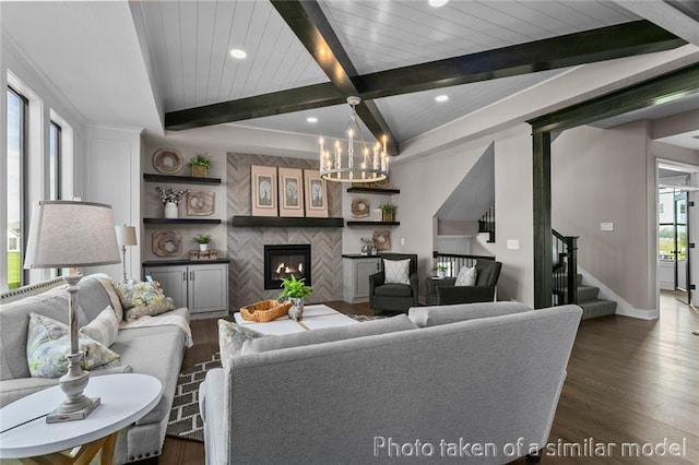 13450 W 179th Ter, Overland Park, KS 66013 - living room with a tiled fireplace, stairs, a chandelier, beamed ceiling, and dark wood-style floors