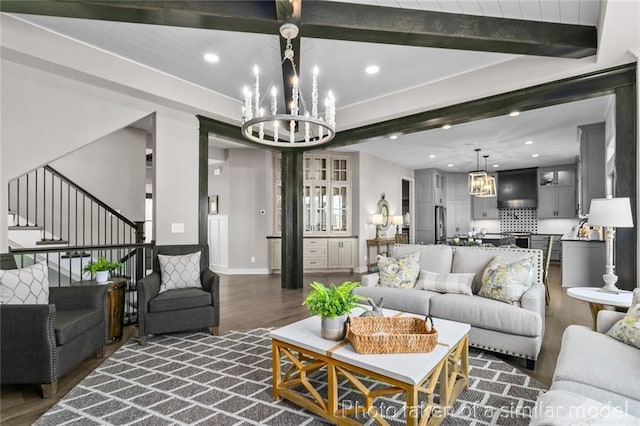 13450 W 179th Ter, Overland Park, KS 66013 - living room featuring dark wood-style flooring, beam ceiling, recessed lighting, and an inviting chandelier