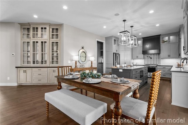 13450 W 179th Ter, Overland Park, KS 66013 - dining space featuring a notable chandelier, dark wood-type flooring, and recessed lighting