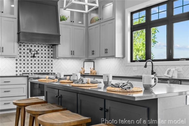 13450 W 179th Ter, Overland Park, KS 66013 - kitchen featuring premium range hood, stainless steel electric range, decorative backsplash, and dark countertops