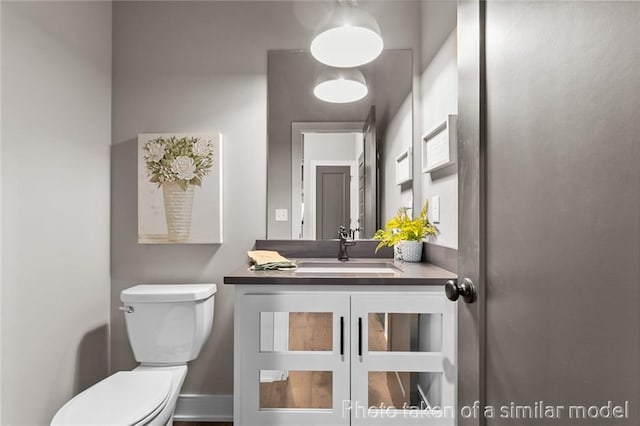 13450 W 179th Ter, Overland Park, KS 66013 - half bathroom with toilet, baseboards, and vanity