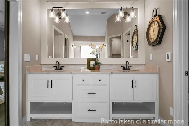13450 W 179th Ter, Overland Park, KS 66013 - bathroom with a sink, double vanity, and baseboards