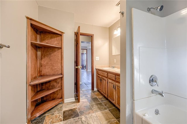 bathroom featuring vanity and shower / bathtub combination