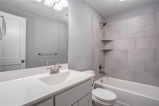 full bath featuring bathtub / shower combination, visible vents, vanity, and toilet